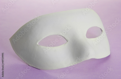 White mask, on purple background