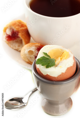 Light breakfast with boiled egg and cup of coffee, isolated