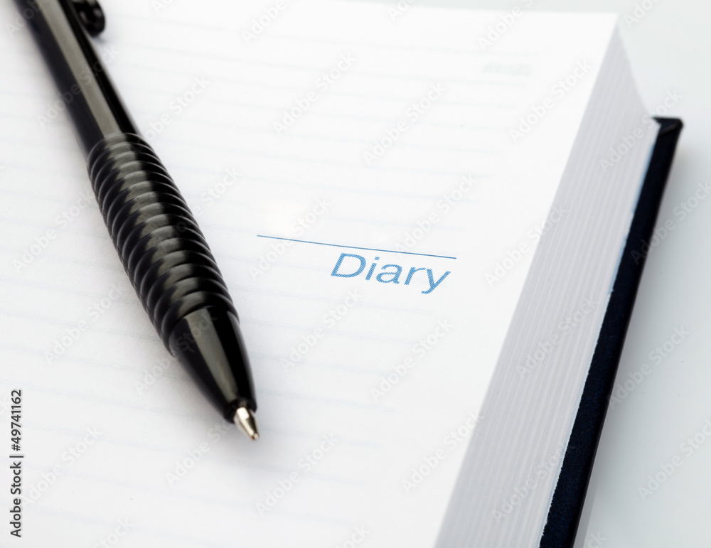 Open notebook with pen Open notebook with pen