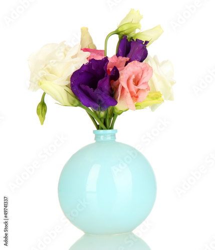 Bouquet of eustoma flowers in vase isolated on white