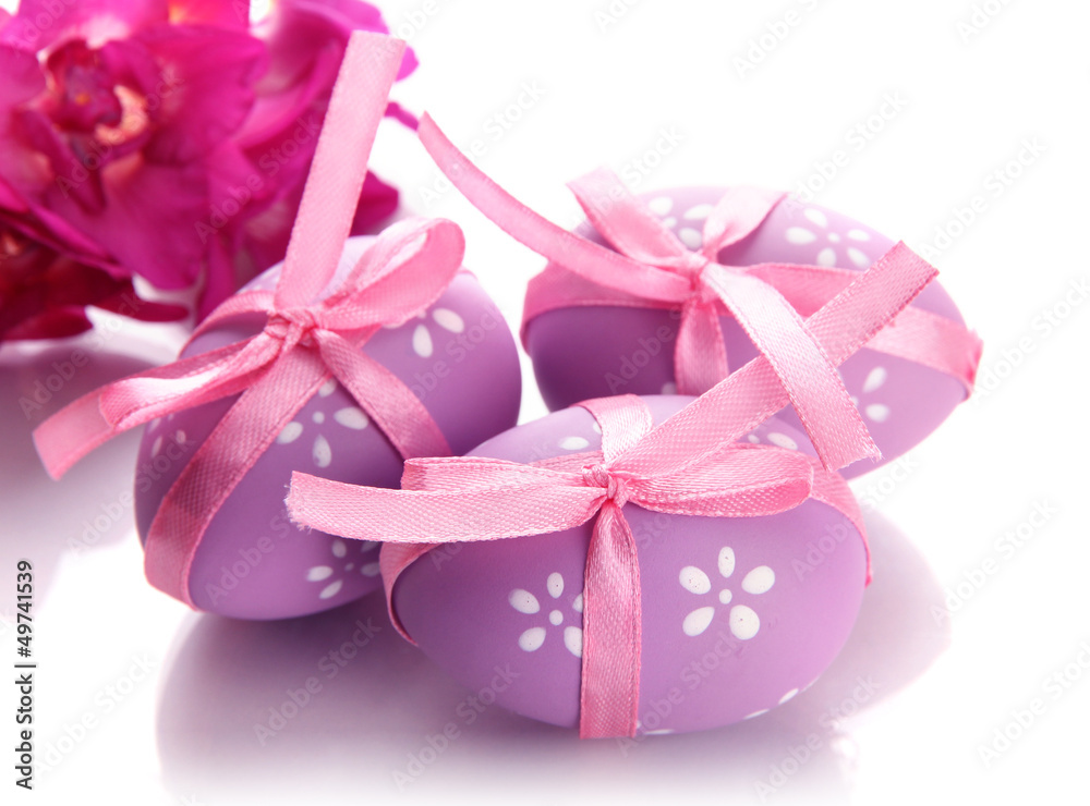 Bright easter eggs with bows and flowers, isolated on white Bright easter eggs with bows and flowers, isolated on white
