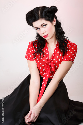 woman pin-up make-up hairstyle posing in studio