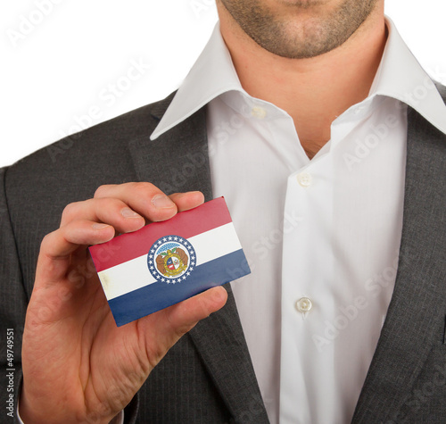 Businessman is holding a business card, Missouri photo