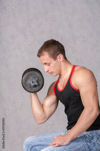 Man Working Out With A Dumbbell On White