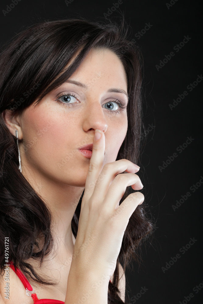 Naklejka premium Young girl asking for silence