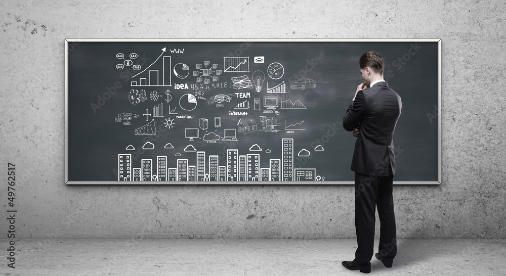 man looking at business strategy man looking at business strategy