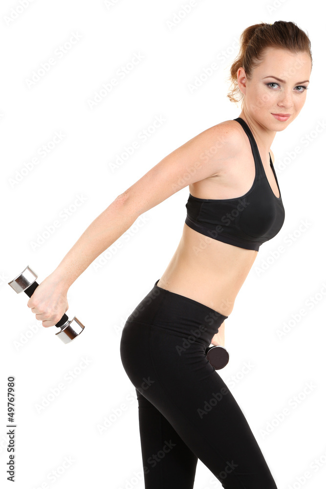 Fototapeta premium Young woman doing fitness exercises with dumbbell isolated