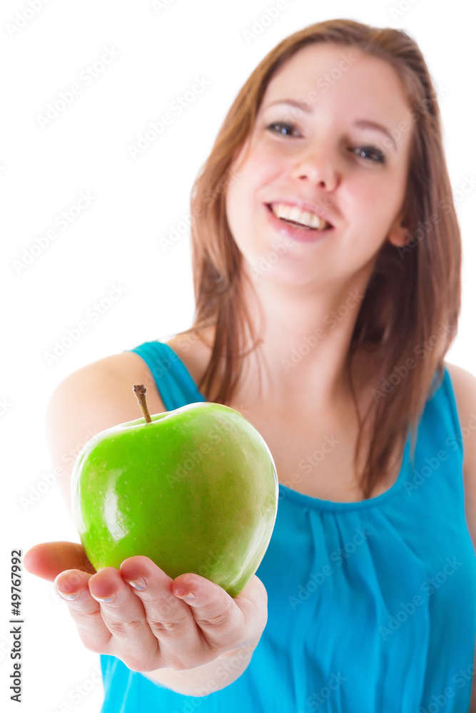 Young woman giving healthy green apple Young woman giving healthy green apple