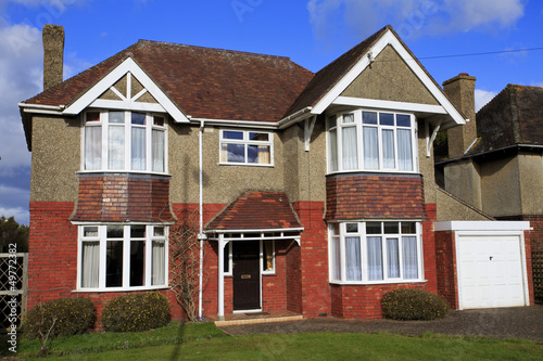 Pebble dashed detached house with garage
