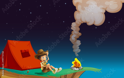 A boy scout camping near the cliff