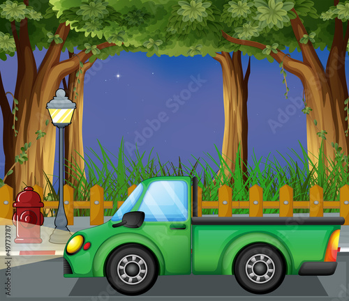 A green car at the street