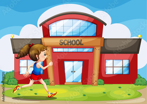 A girl in front of the school building
