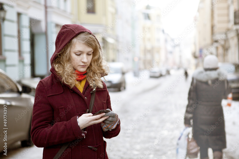 Fototapeta premium Beautiful young woman with mobile