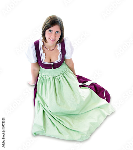 Junge, sitzende Frau im Dirndl photo