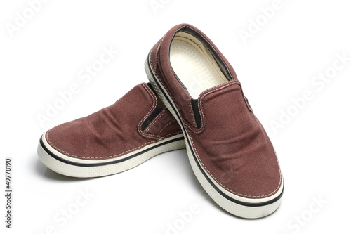 brown slip-on casual shoes over a white background