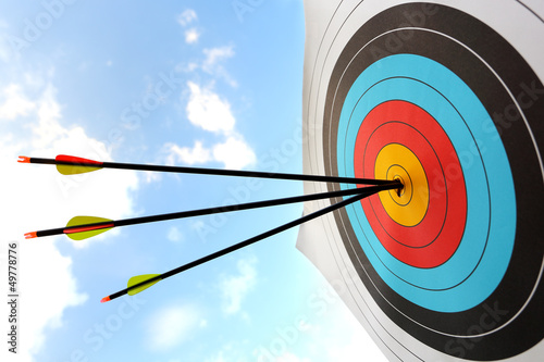 Photo Arrow hit goal ring in archery target