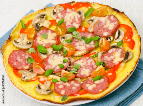 pizza with sausage, mushrooms and vegetables