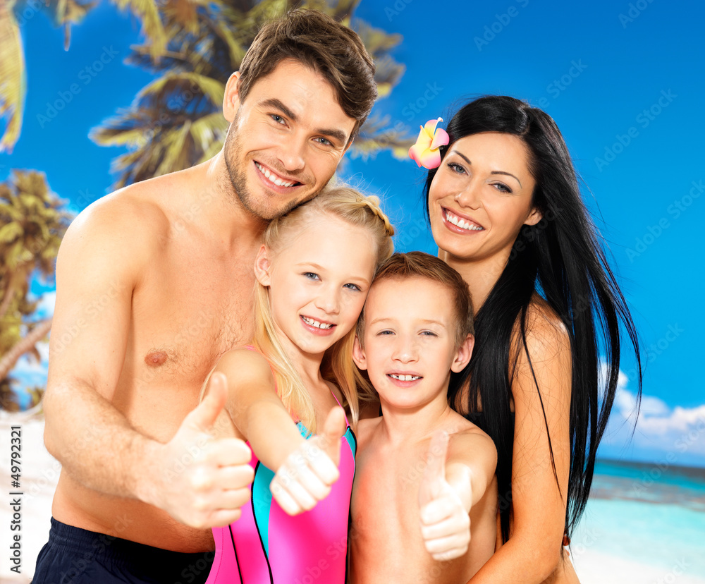 Happy smiling family with thumbs up sign Happy smiling family with thumbs up sign