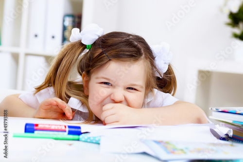 Little girl and her mother studying