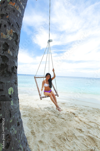 Womain in beach hammock