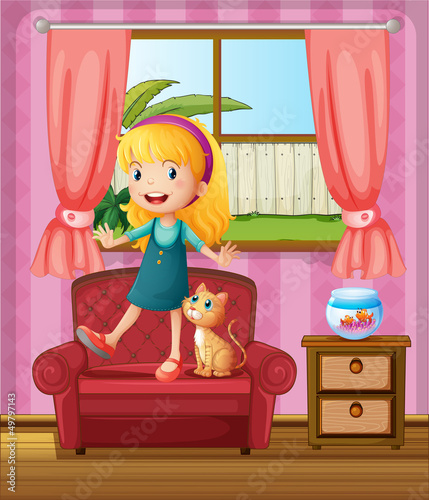 A girl and a cat in a sofa