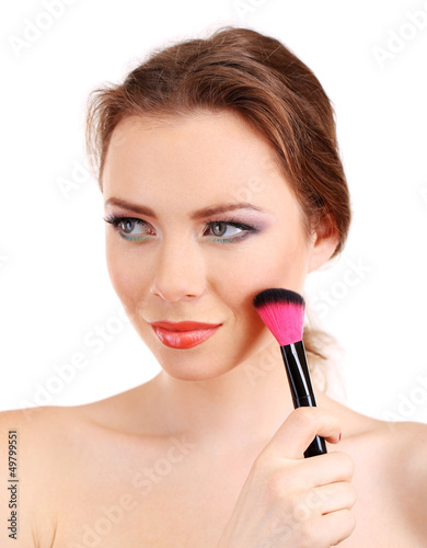 portrait of beautiful woman with make-up brush for powder,