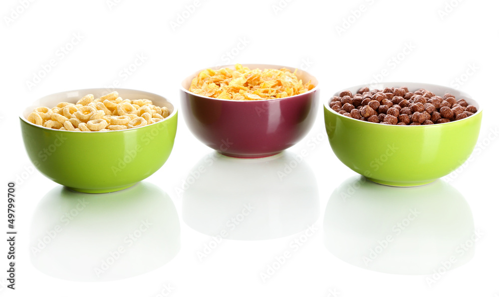 Delicious and healthy cereal in bowls isolated on white Delicious and healthy cereal in bowls isolated on white