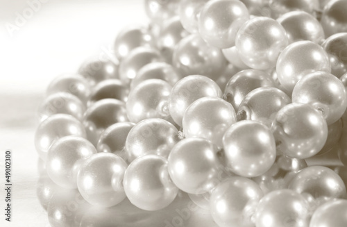 White pearl on reflective surface