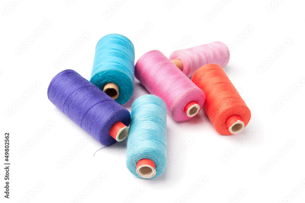 Colorful thread bobbins, isolated on white background Colorful thread bobbins, isolated on white background