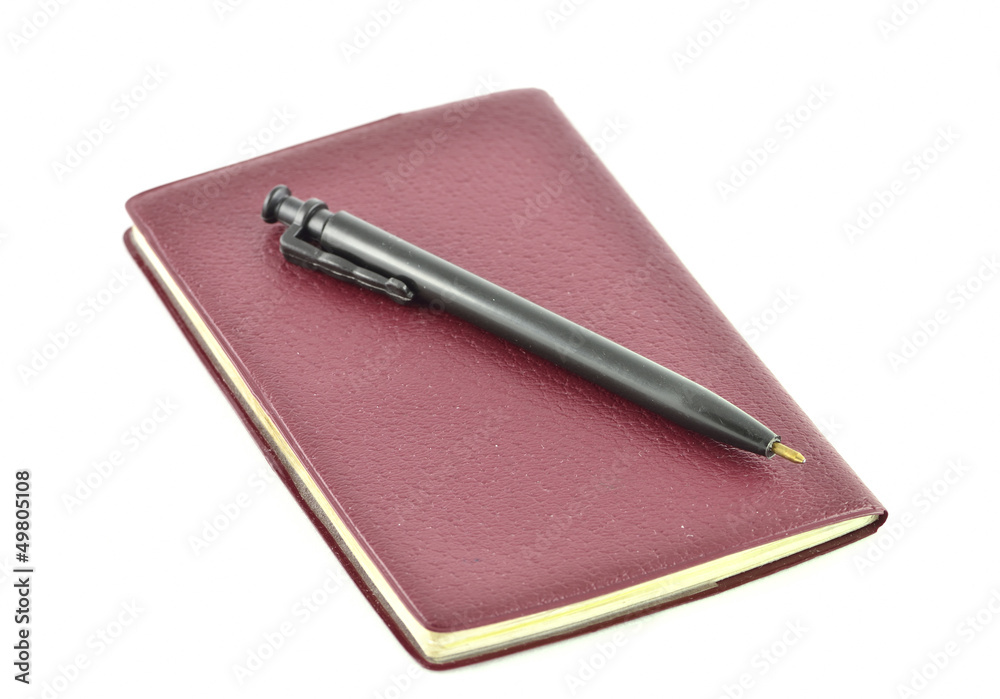 red notebook and pen red notebook and pen
