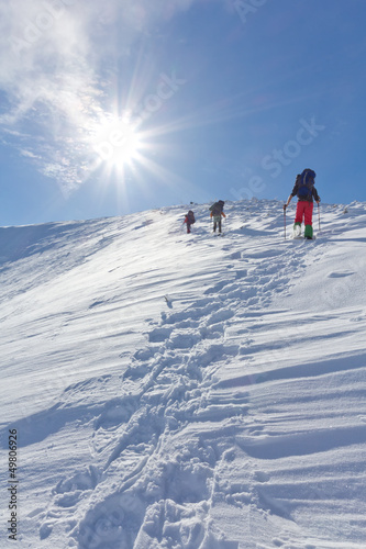 hikers walk upwards