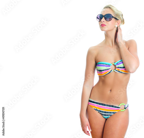 Blonde girl in striped bikini and sunglasses © M-Production