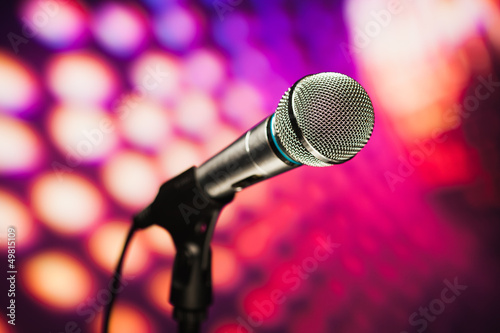 microphone against purple disco background