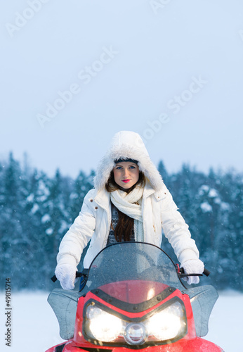 Woman and snowmobile photo