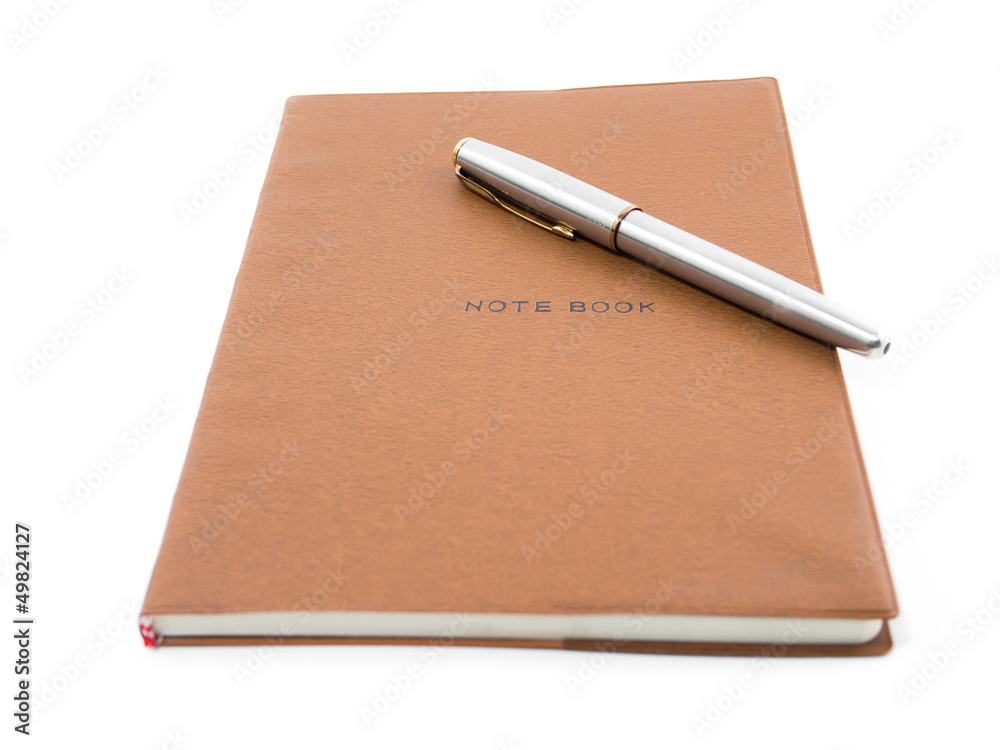Brown notebook with pen isolated on white Brown notebook with pen isolated on white