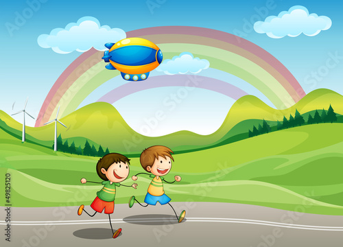 Kids running with an airship above