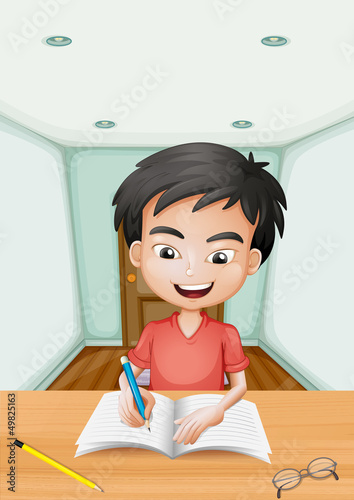 A boy writing a letter