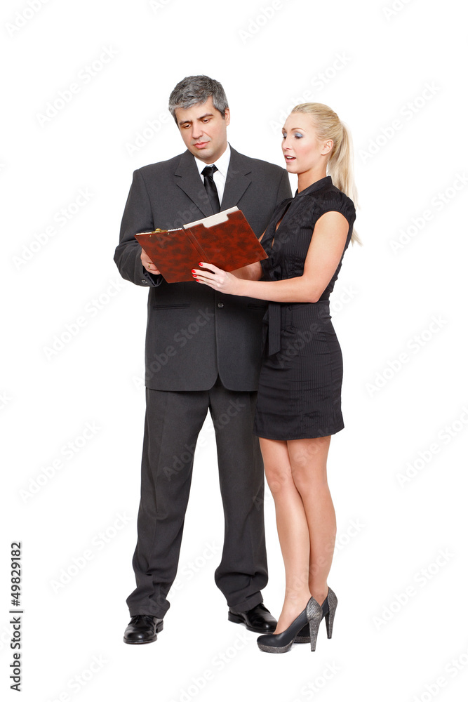 Businesswoman showing the checklist to businessman Businesswoman showing the checklist to businessman