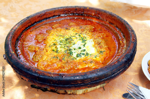 Morocco national dish - tajine of meet with eggs and vegetables photo