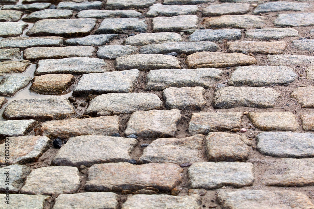 The granite block pavement of the old street The granite block pavement of the old street