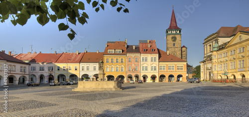 square with arcades, a fountain and a tower