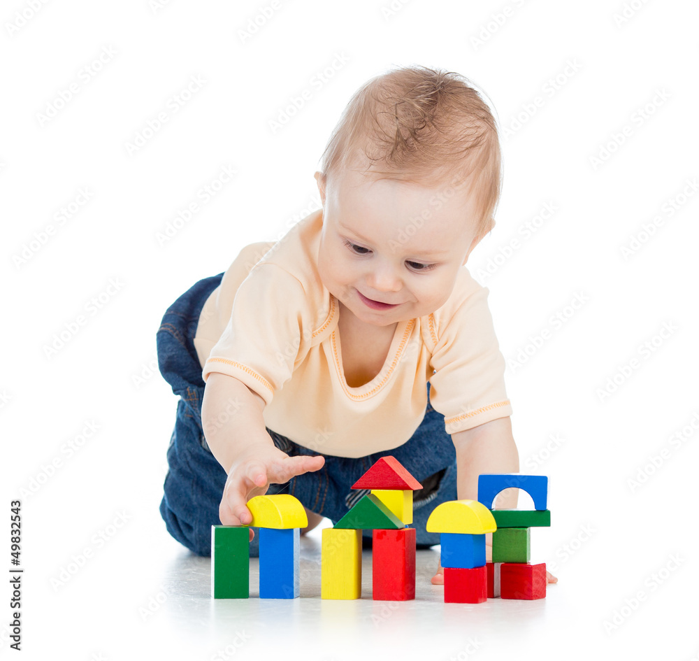 little child playing with building blocks little child playing with building blocks