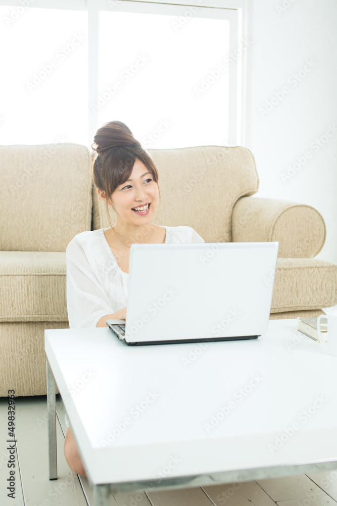 Beautiful asian woman using a laptop computer Beautiful asian woman using a laptop computer