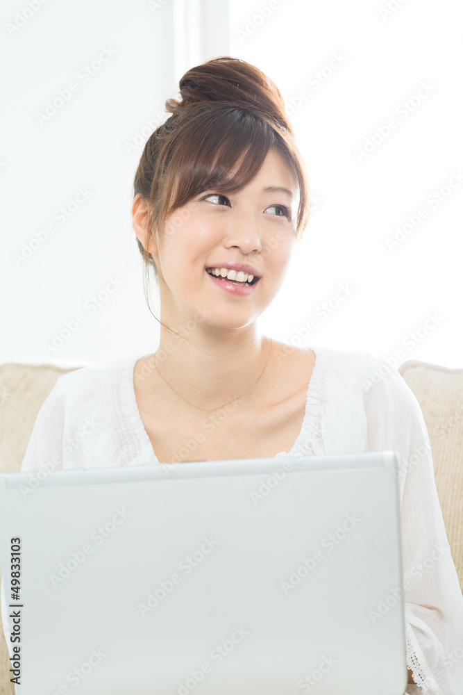 Beautiful asian woman using a laptop computer Beautiful asian woman using a laptop computer