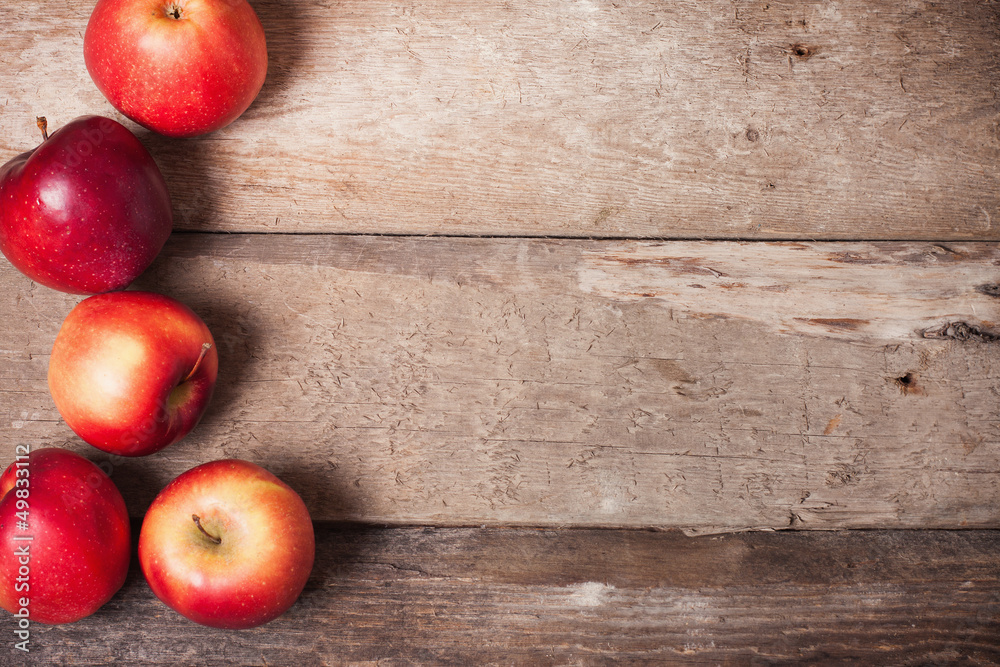 red apples on wooden background red apples on wooden background