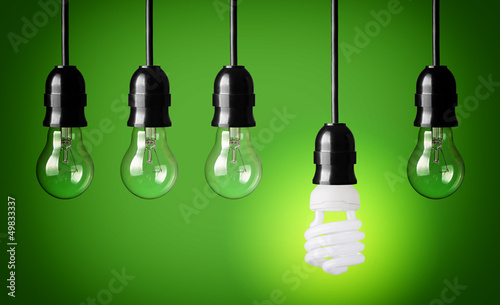 Idea concept with light bulbs and energy save bulb.