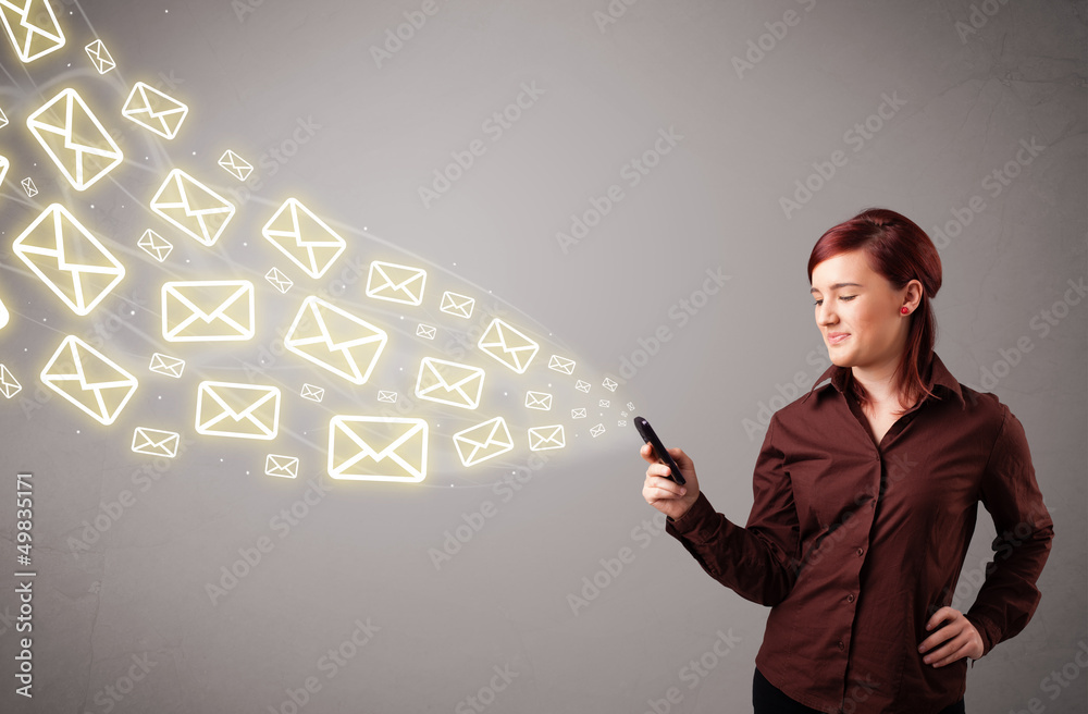 attractive young lady holding a phone with message icons attractive young lady holding a phone with message icons