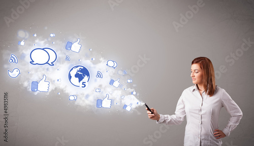 Pretty young girl holding a phone with social media icons