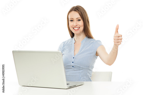 Woman with laptop showing thumbs up