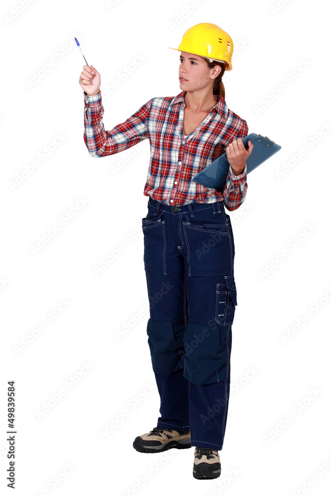 craftswoman holding a notepad and a pen craftswoman holding a notepad and a pen